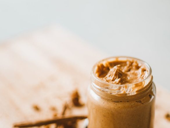 jar with peanut butter on table